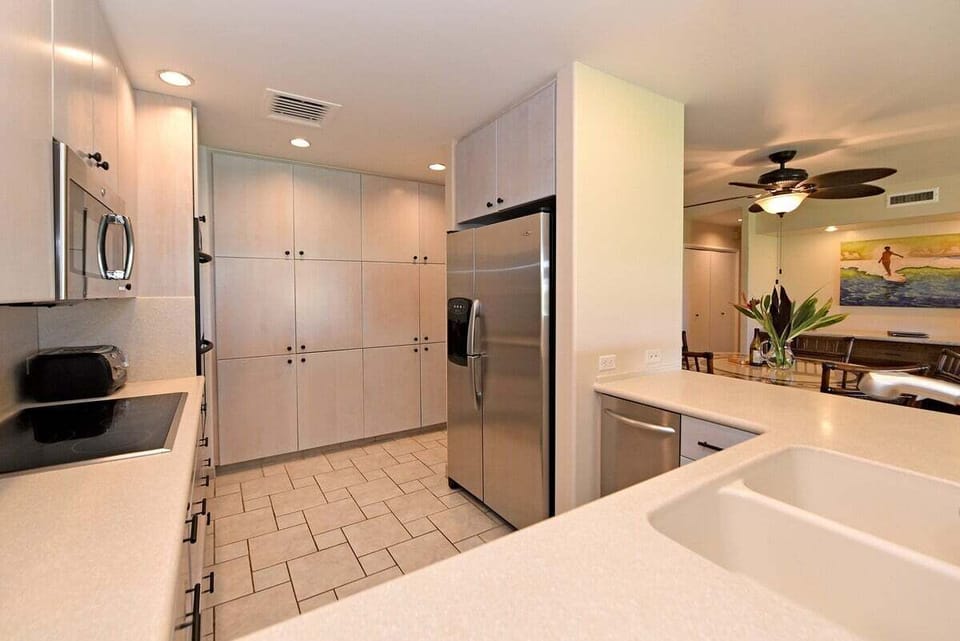 Modern kitchen with stainless steel appliances and ample cabinet storage