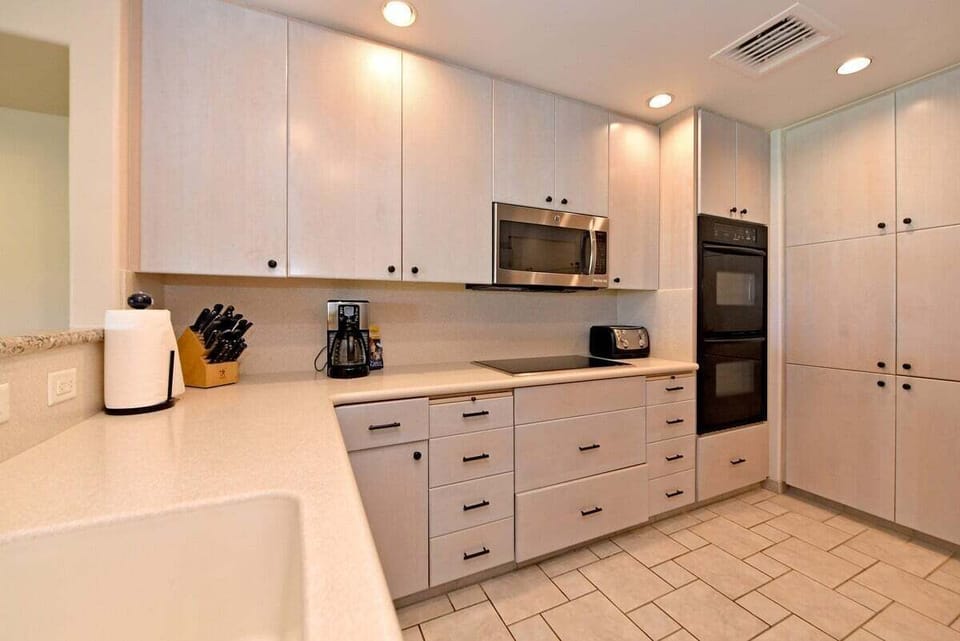 Bright kitchen featuring sleek appliances and spacious countertops