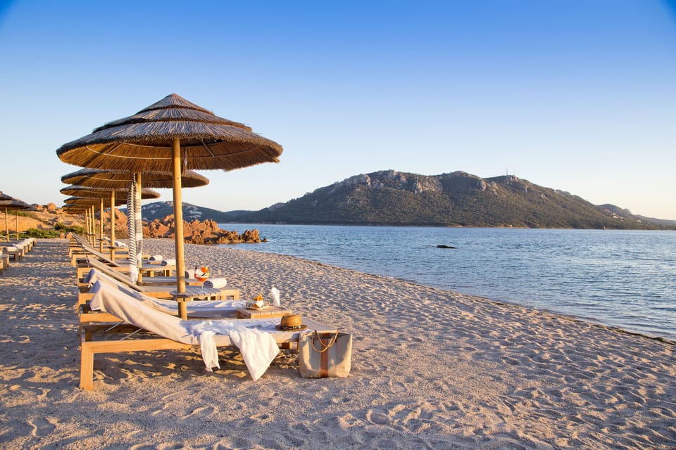 Private beach, white sand, sun loungers, beach umbrellas