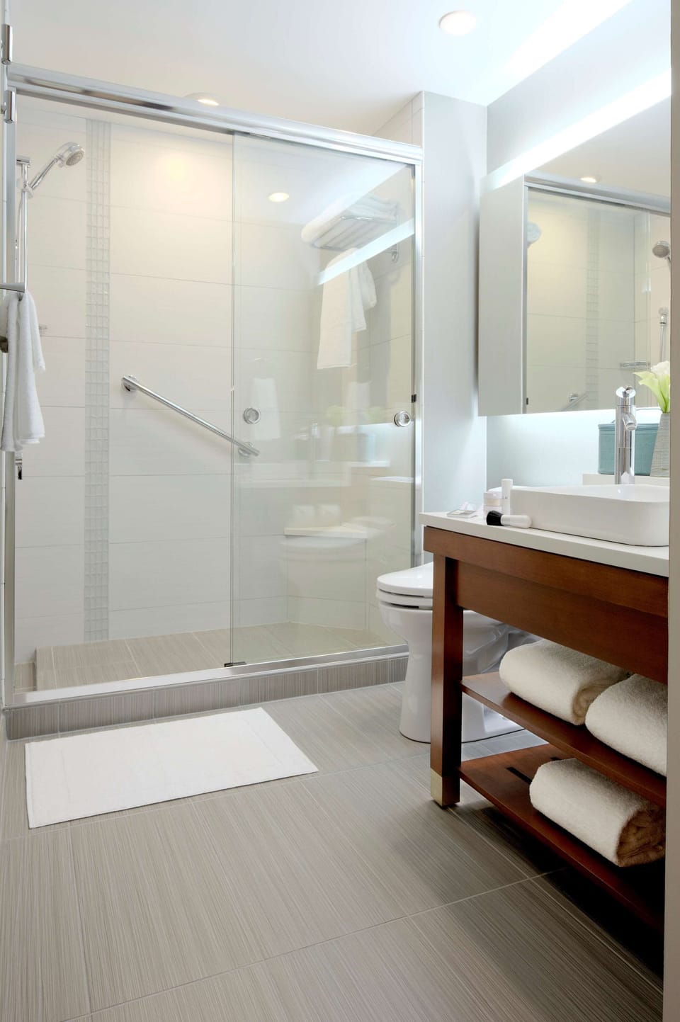 Designer toiletries, hair dryer, towels