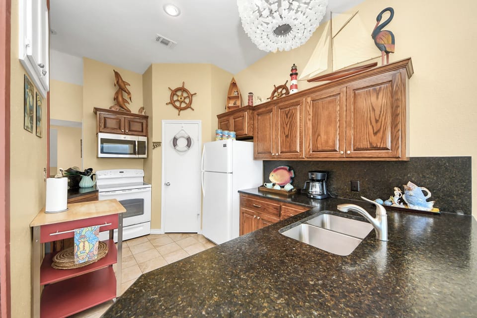 Kitchen view with full appliances