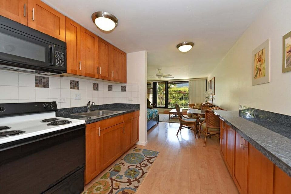 Functional open-plan design showcasing a dining area, kitchen, and living room for a comfortable stay