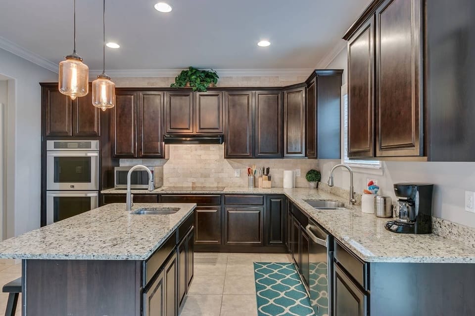 Kitchen comes equipped with a double oven, two pantries and two refrigerators.