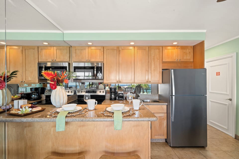 Fully equipped kitchen with bar seating and modern appliances.