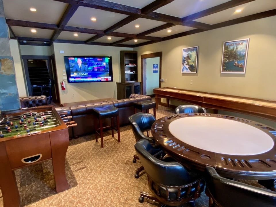 Game Room w/ billiards, foosball, shuffleboard, ping pong, card table, & 85" TV.