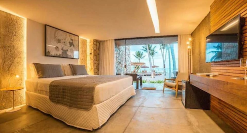 Bangalô Frente mar | Minibar, in-room safe, individually decorated, individually furnished