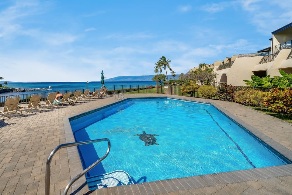 Beautiful beachfront pool area offering stunning ocean views and plenty of space to unwind