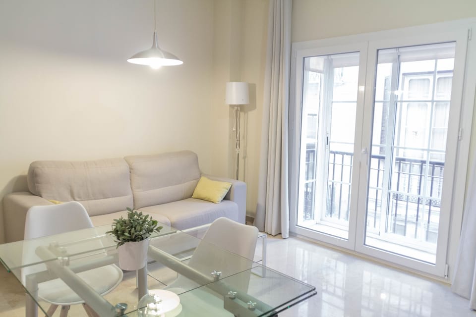 Apartment, 1 Bedroom, Balcony | Living room | Flat-screen TV