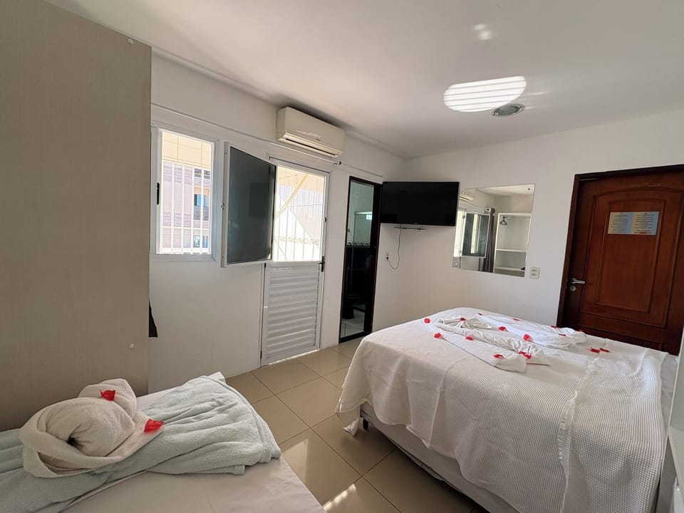 Basic Triple Room | Blackout drapes, iron/ironing board, free WiFi, bed sheets
