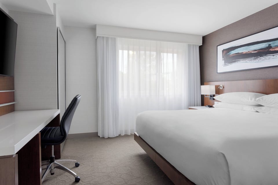 Premium bedding, desk, blackout drapes, iron/ironing board