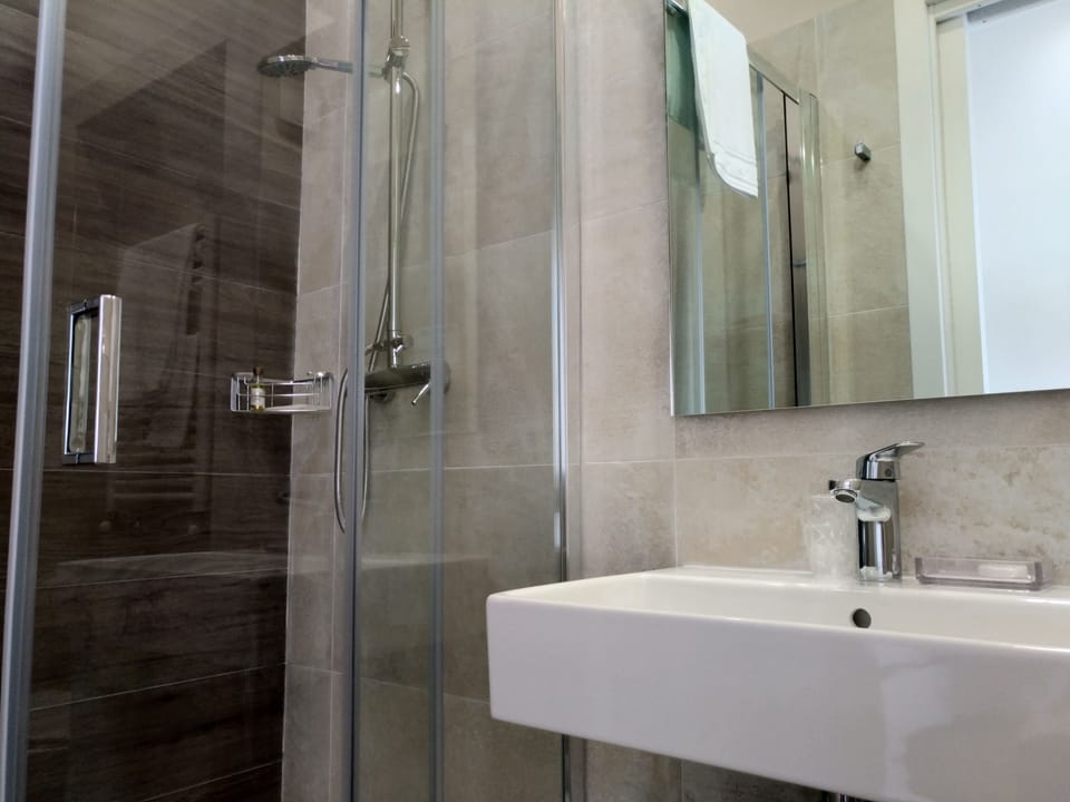Single Room | Bathroom | Shower, free toiletries, hair dryer, bathrobes