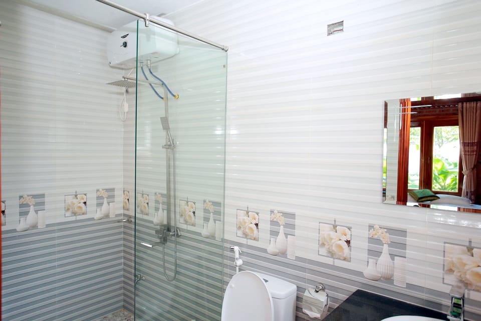 Shower, free toiletries, hair dryer, slippers
