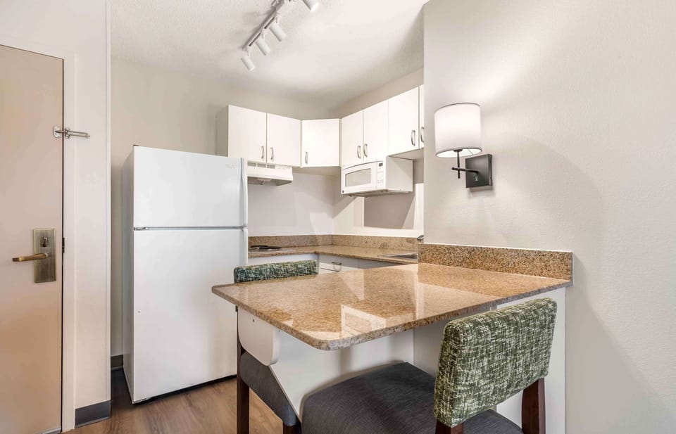 Deluxe Studio, 1 King Bed with Sofa bed, Non Smoking | Private kitchen | Full-size fridge, microwave, stovetop, coffee/tea maker