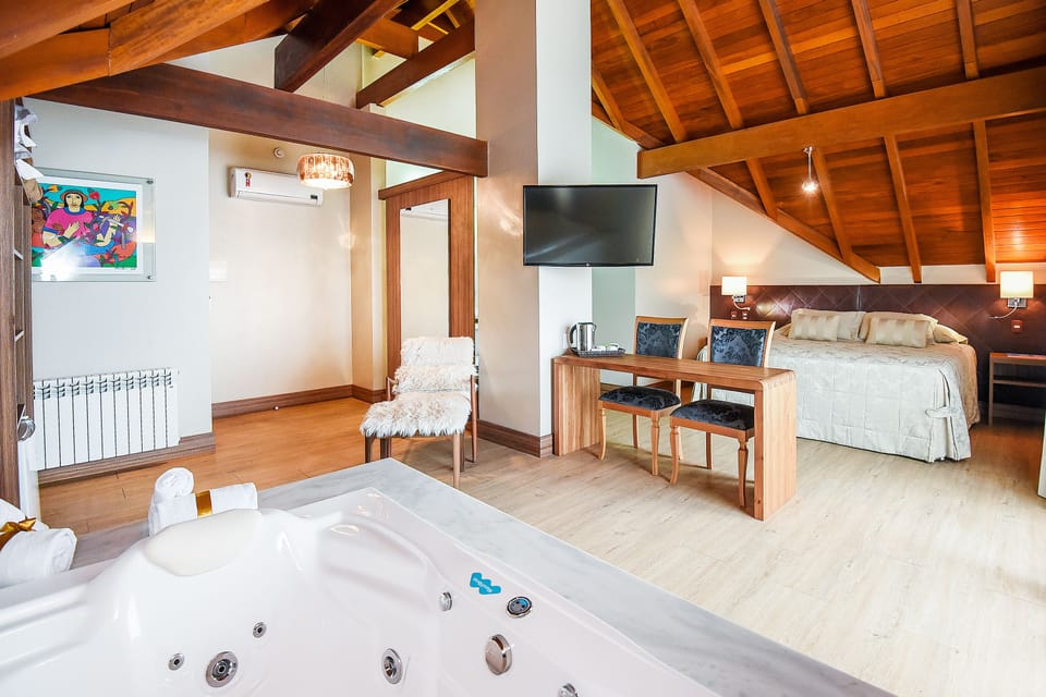Luxury Suite, Jetted Tub | Premium bedding, minibar, in-room safe, desk