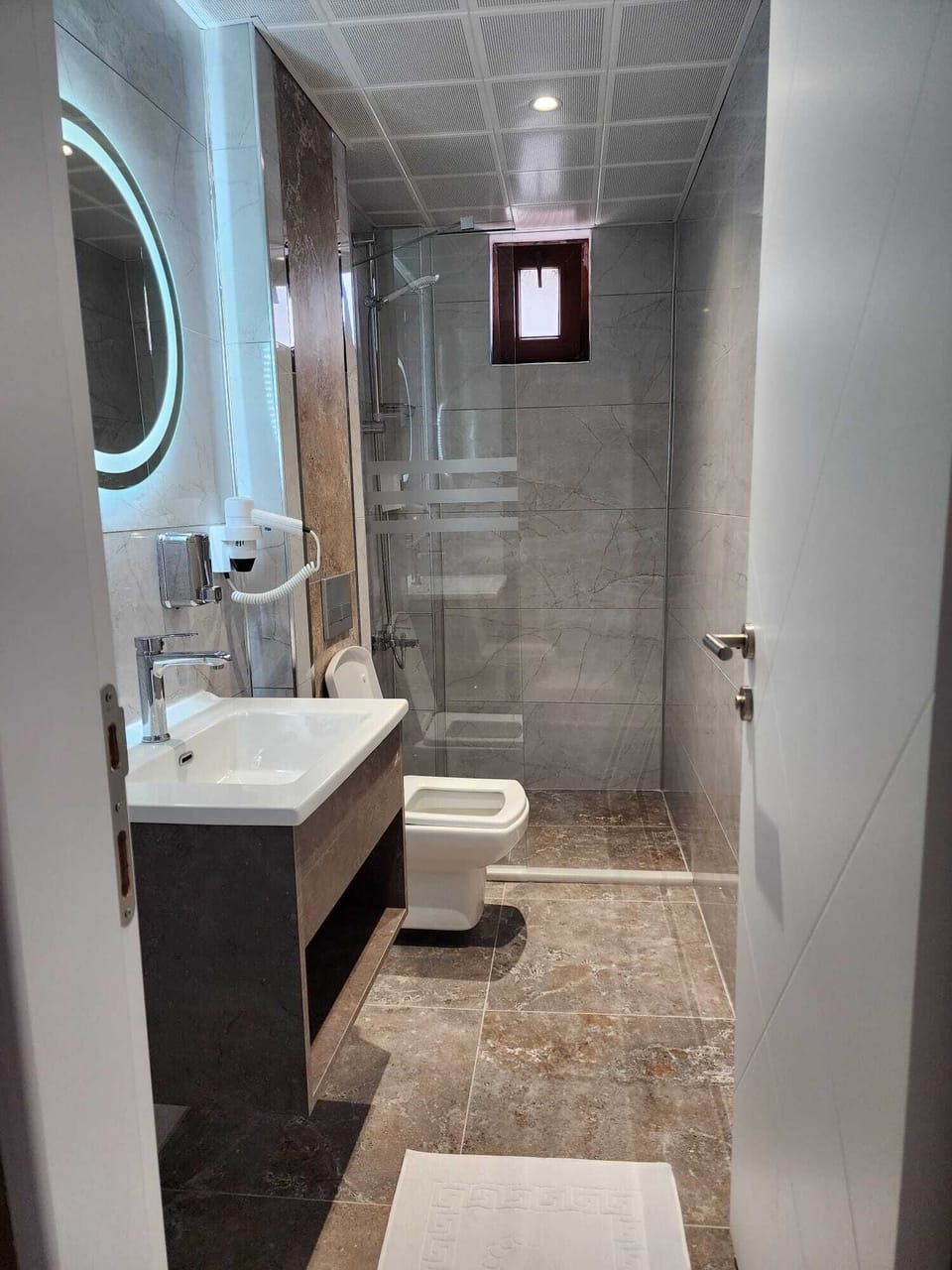 Shower, free toiletries, hair dryer, slippers