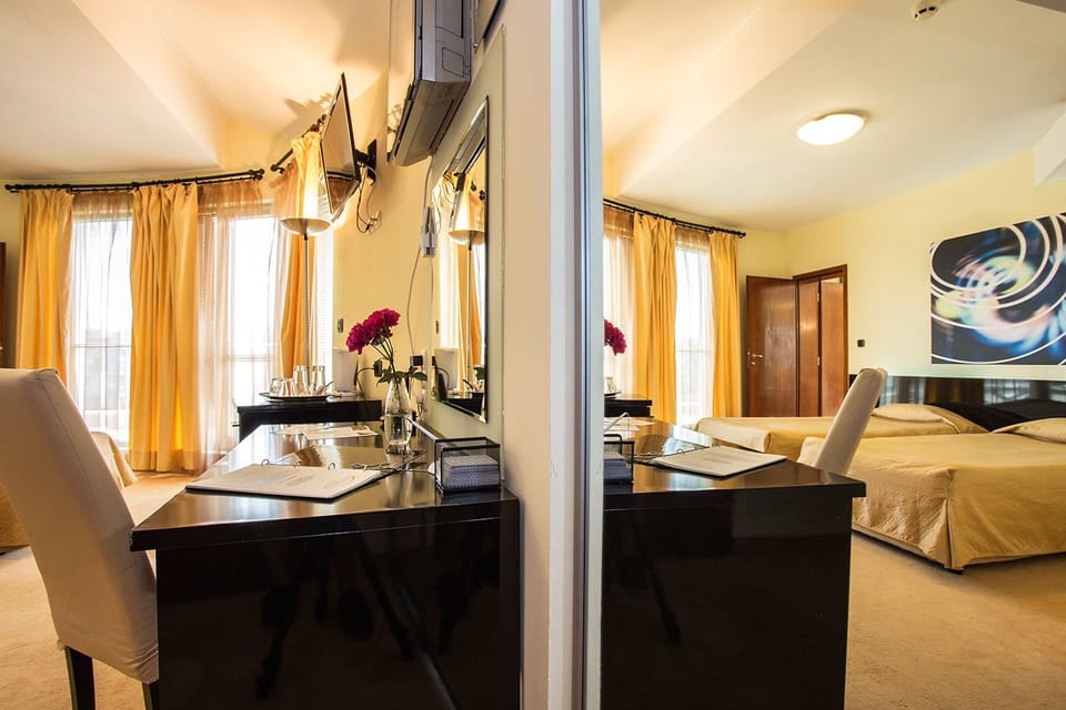 Deluxe Room (with Free underground parking) | Desk, soundproofing, free cribs/infant beds, free WiFi