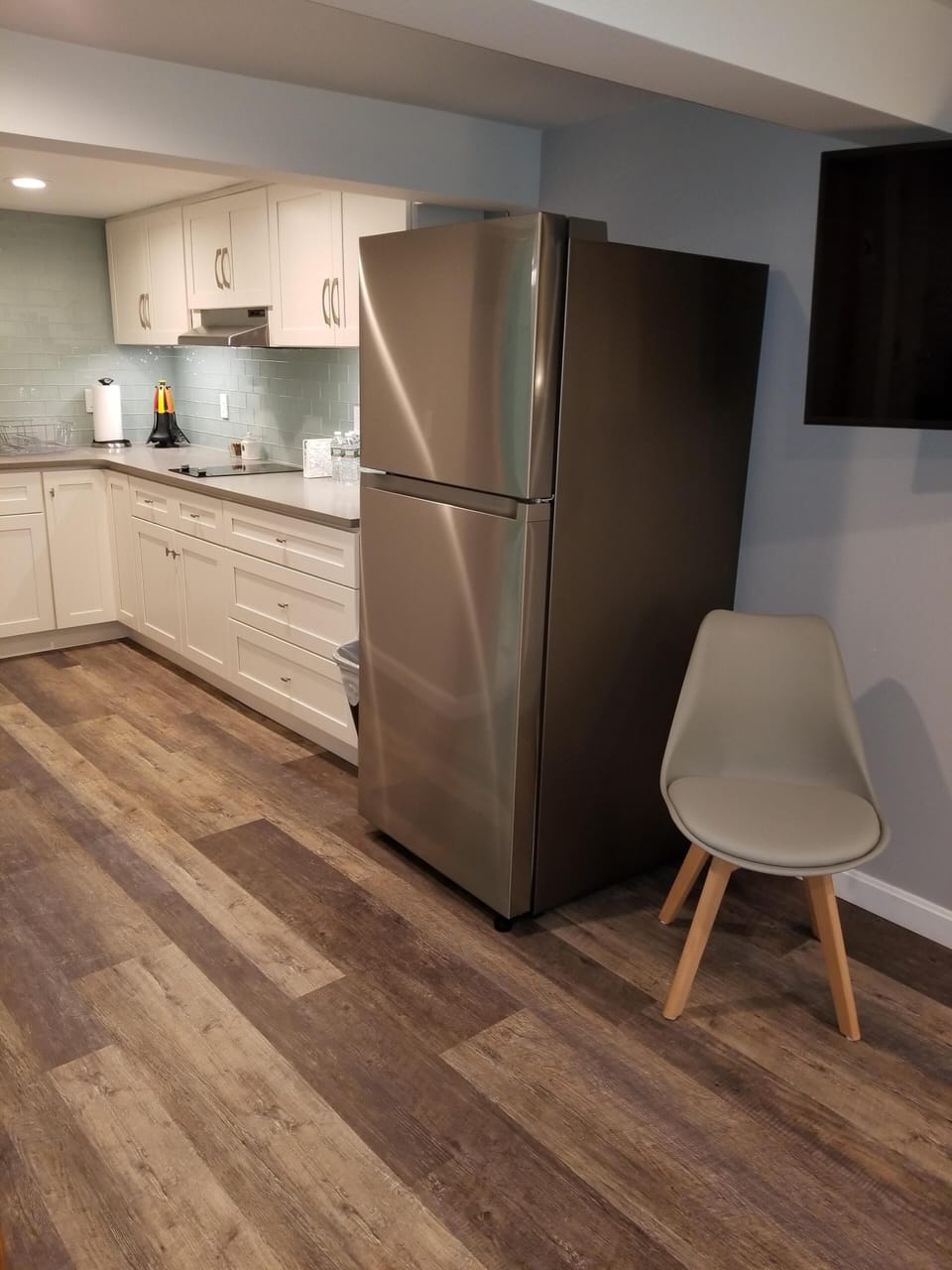 Open concept kitchen with full size refrigerator 
