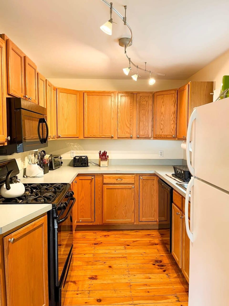 This fully equipped kitchen has everything you need to prepare meals, featuring modern appliances, cooking utensils, pots, pans, and all the essentials for a stress-free cooking experience.