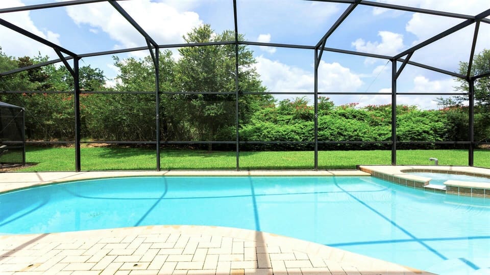 Year-round swimming: Screened pool for endless fun.