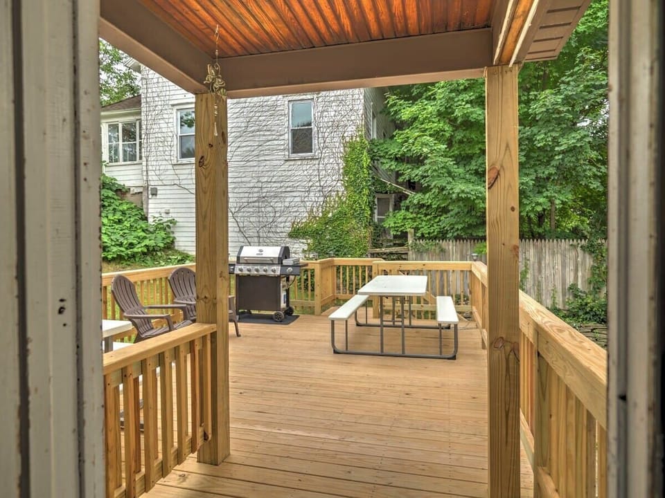Large back deck with grill, picnic table, and plenty of seating for everyone!