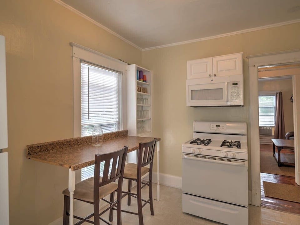 This fully equipped kitchen has everything you need to prepare meals, featuring modern appliances, cooking utensils, pots, pans, and all the essentials for a stress-free cooking experience.