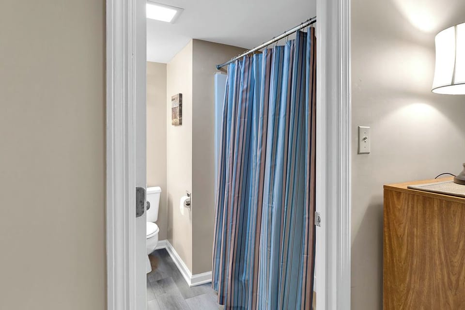 second bath - The second bedroom downstairs has this private bath that is accessed from the bedroom area or it can be entered from the hall way if desired.