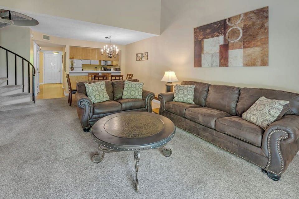 large living area with sprial staircase to upstairs bedroom