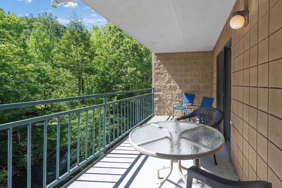 Large private balcony overlooking the river.