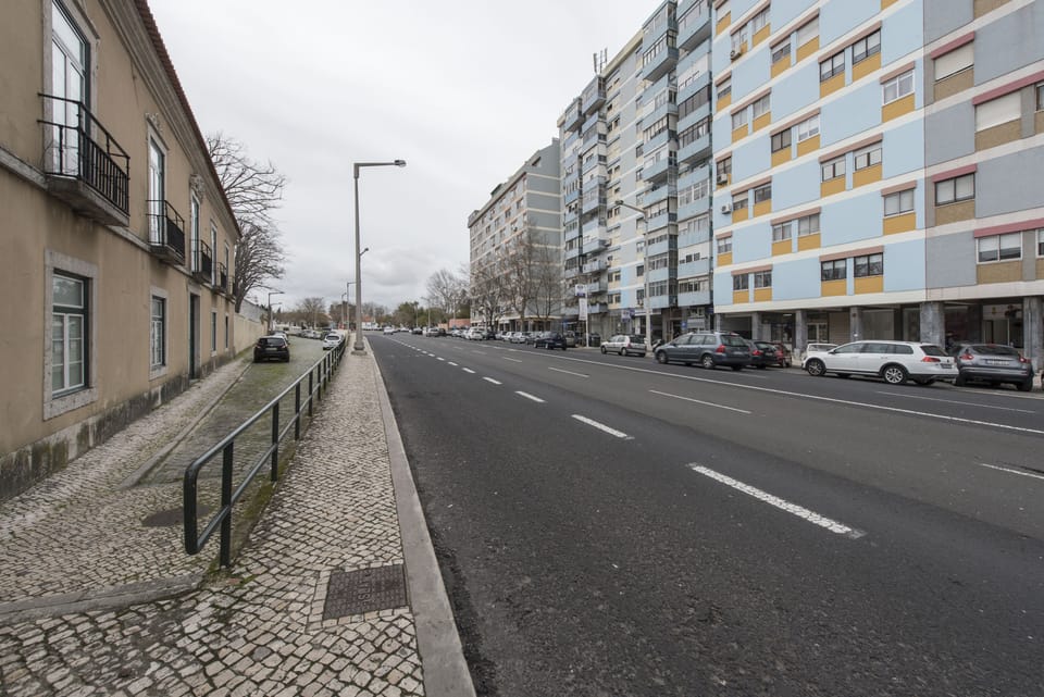 Street view and building facade. View of the public street parking.