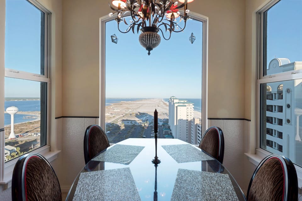 Breakfast room dining with custom made table & chairs and sound & gulf views