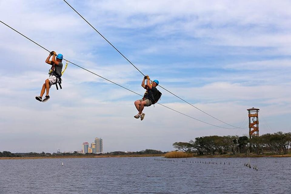 Zipping Over Gulf State Park Lake Shelby in Gulf Shores.