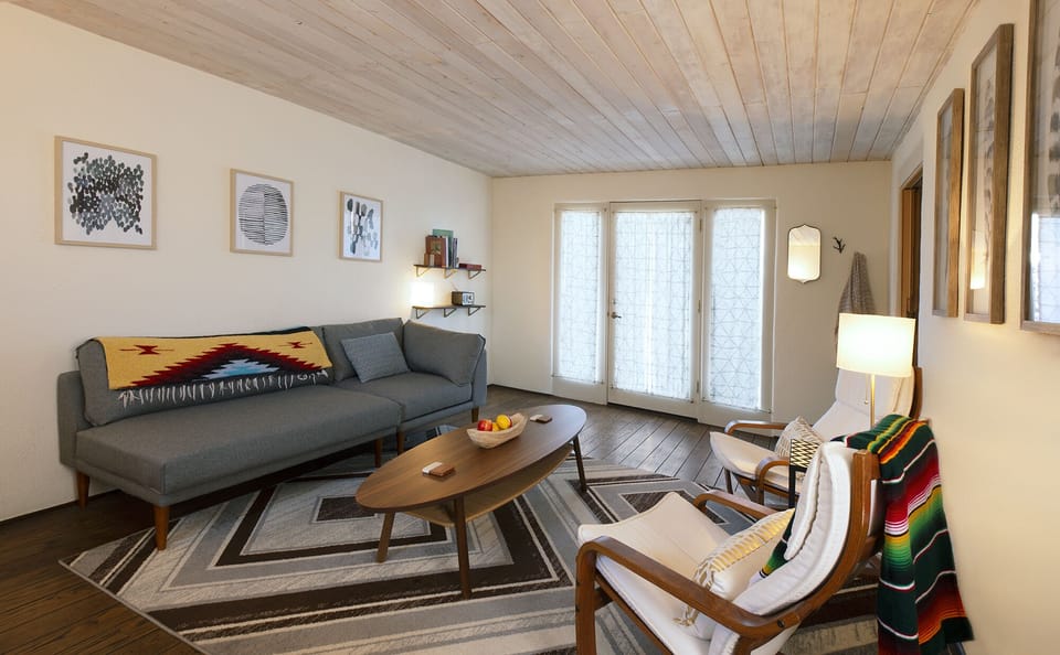 Living/dining room: French doors open to fenced entry walkway 