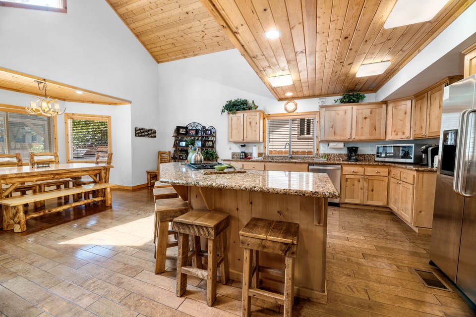Dining Room. - Bar dining area as well as a dining table all made of logs. Enough seats for everyone!