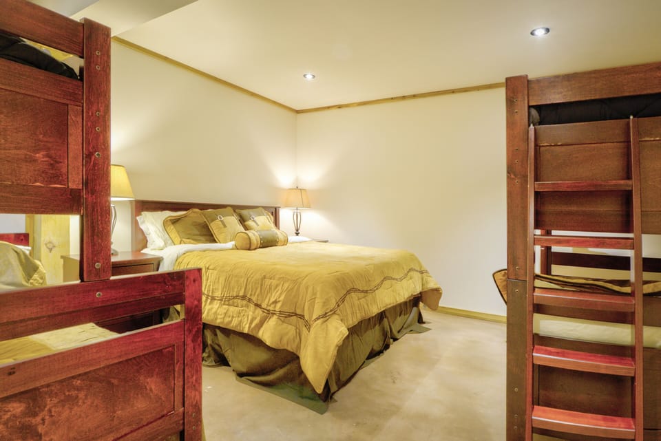 double queen over queen and single over queen bunk beds and large closet.