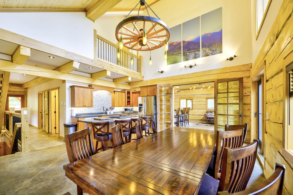 large dining area with table for 12 and an additional 4 seats at the counter and