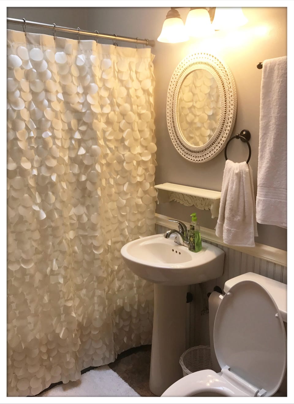 Upstairs bathroom. Additional vanity with sink resides outside of bathroom 