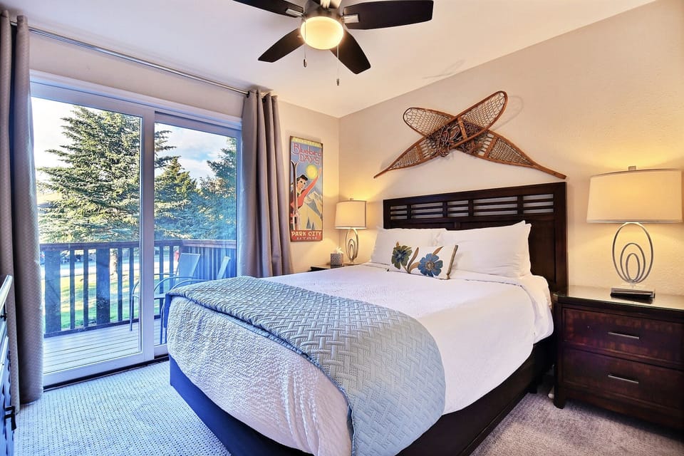 Queen Guest Suite with comfy linens and bedding,  back deck with stream views