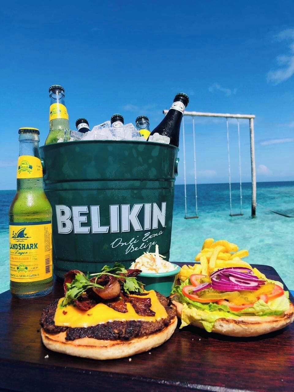 Enjoy a refreshing Belikin with oceanfront island views.