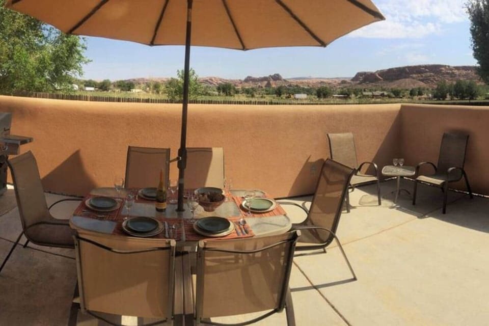 Huge private patio with a view. Large BBQ grill & Umbrella. Seats 12+ with the additional bar table set in next pic.