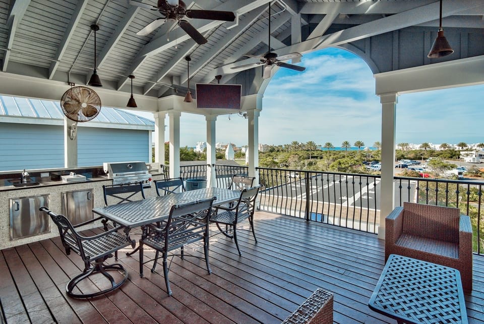 Upper Deck features a large screen TV, gas grill, gas cooktop, sink and frig
