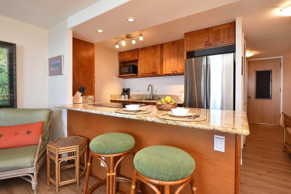 Open-concept design featuring a functional kitchen island and a seamless flow into the living space