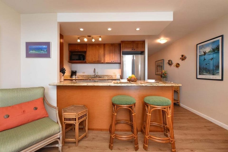 Bright and functional kitchen with natural textures, spacious counters, and bar seating for easy entertaining