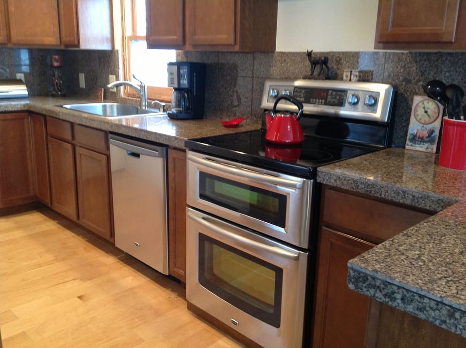 Kitchen- totally remodeled! New cabinets, granite, stainless steel - stocked! 