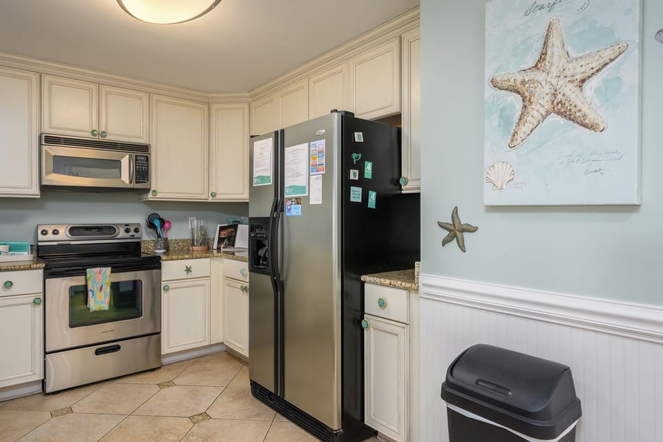 Spacious modern kitchen with all stainless appliances.