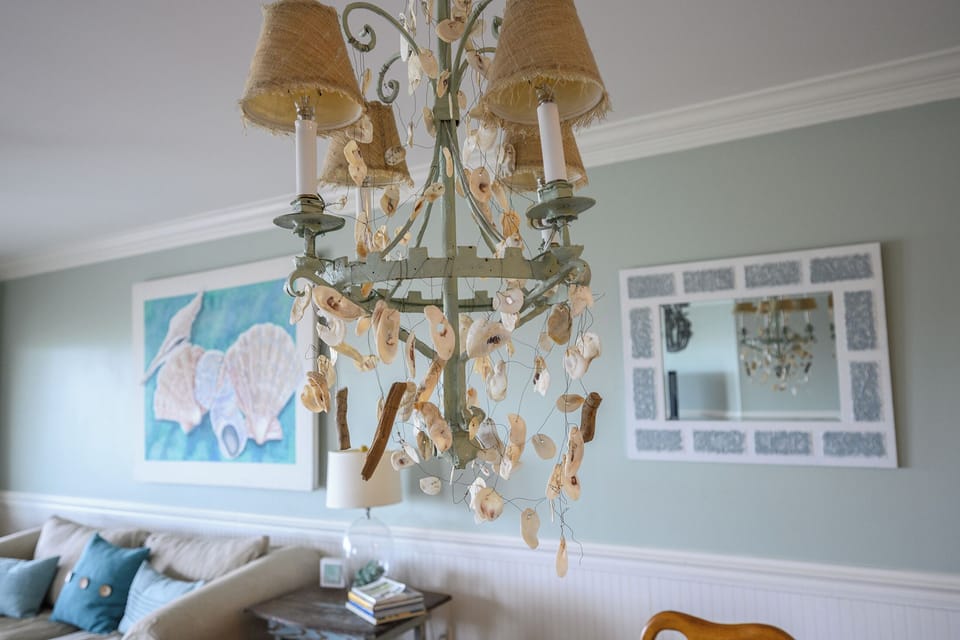 Chandelier over dining table.