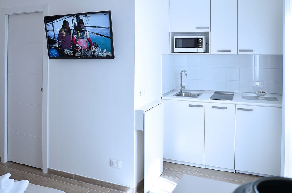 Suite, Balcony | Private kitchenette | Full-size fridge, microwave, stovetop, coffee/tea maker