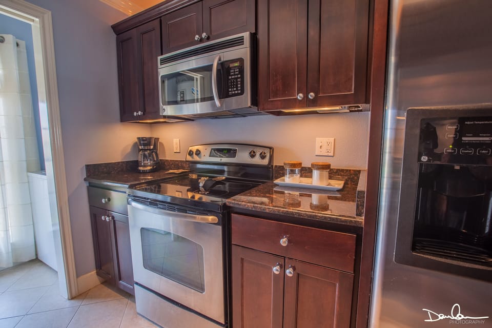 Kitchen with full size appliances and everything needed for preparing a meal