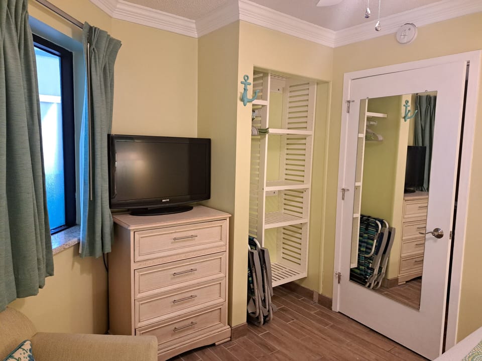 Closet organizers in both guest rooms