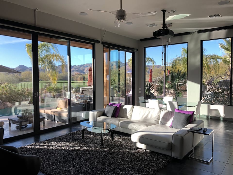 Walls of 12 foot Floor to ceiling  Windows with 180 Mountain & Golf course views