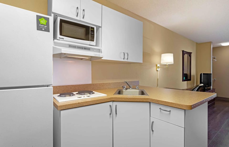 Studio, 1 King Bed, Non Smoking | Private kitchen | Full-size fridge, microwave, stovetop, toaster